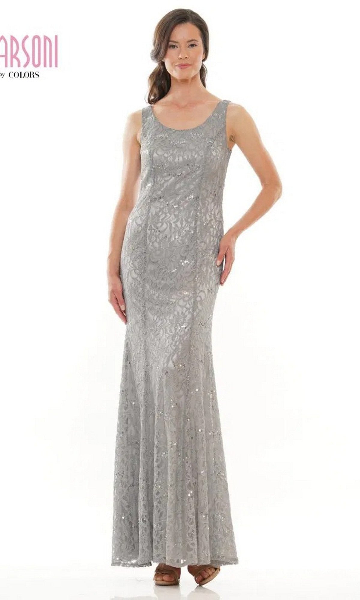 A woman models the Marsoni M301, a sleeveless silver lace long formal dress, standing against a white background.